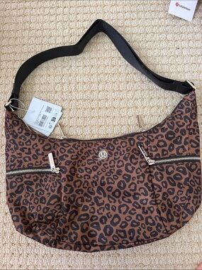lululemon Leopard Print Slouchy Sling Bag with Metal Hardware